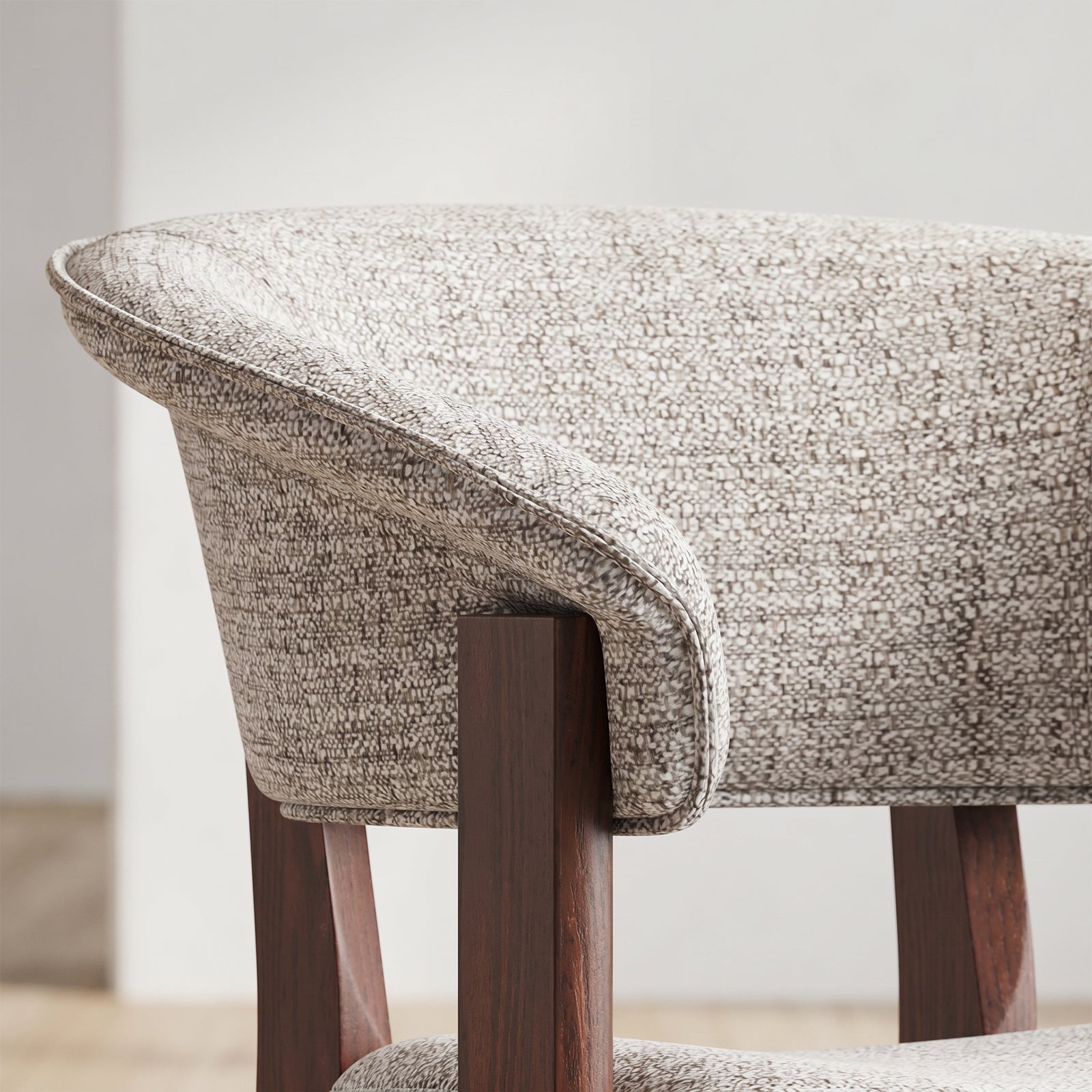 Close-up of the curved upholstered backrest on the COLAMY HALO Luxe dining chair