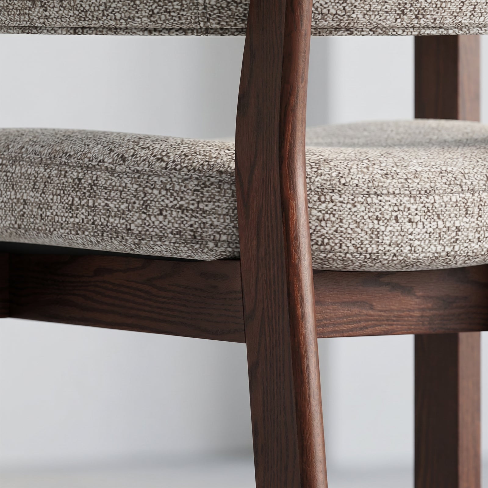 Close-up of mixed-weave seat fabric and solid red oak frame on the HALO Luxe chair