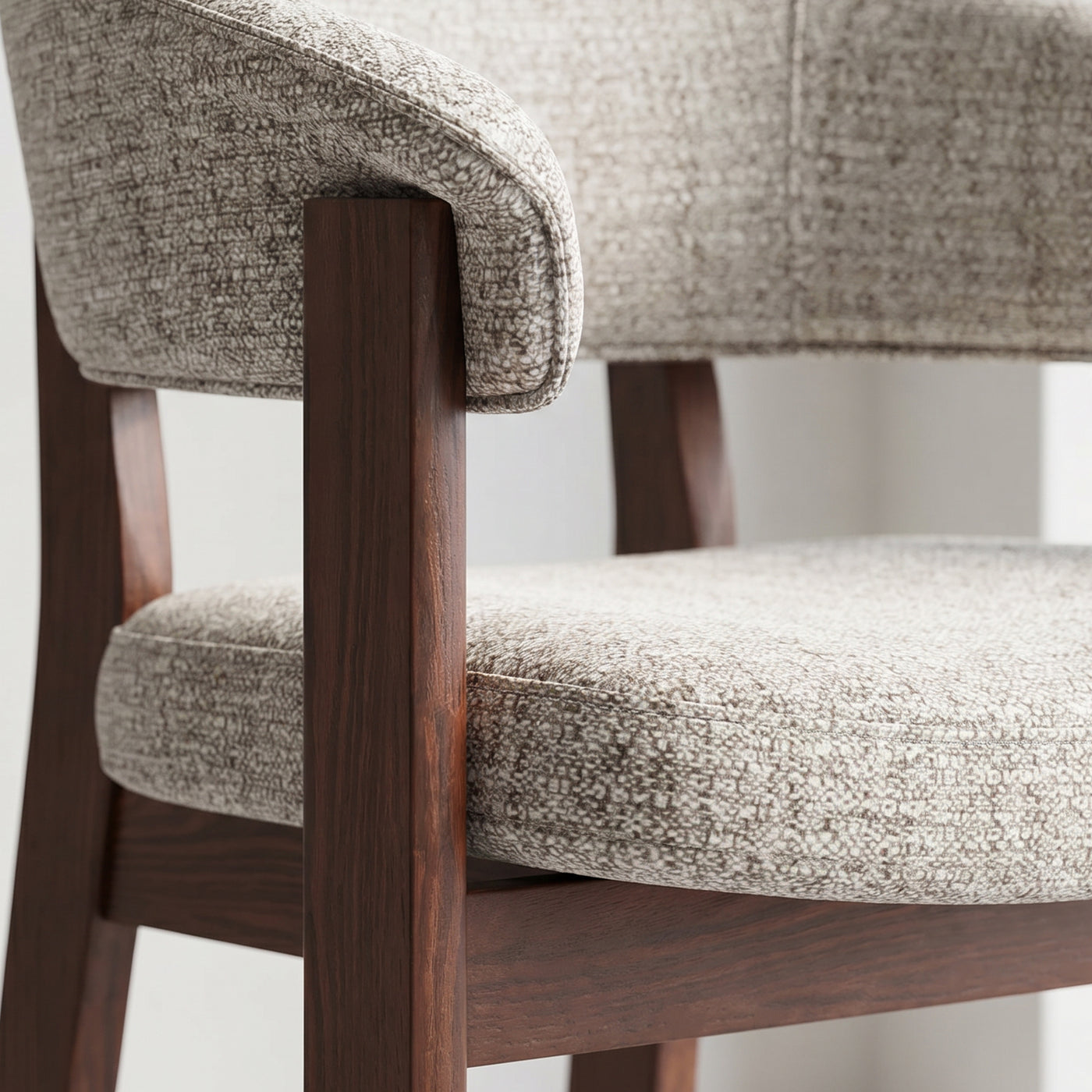Close-up of the walnut oak frame and upholstered backrest joinery on the HALO Luxe chair