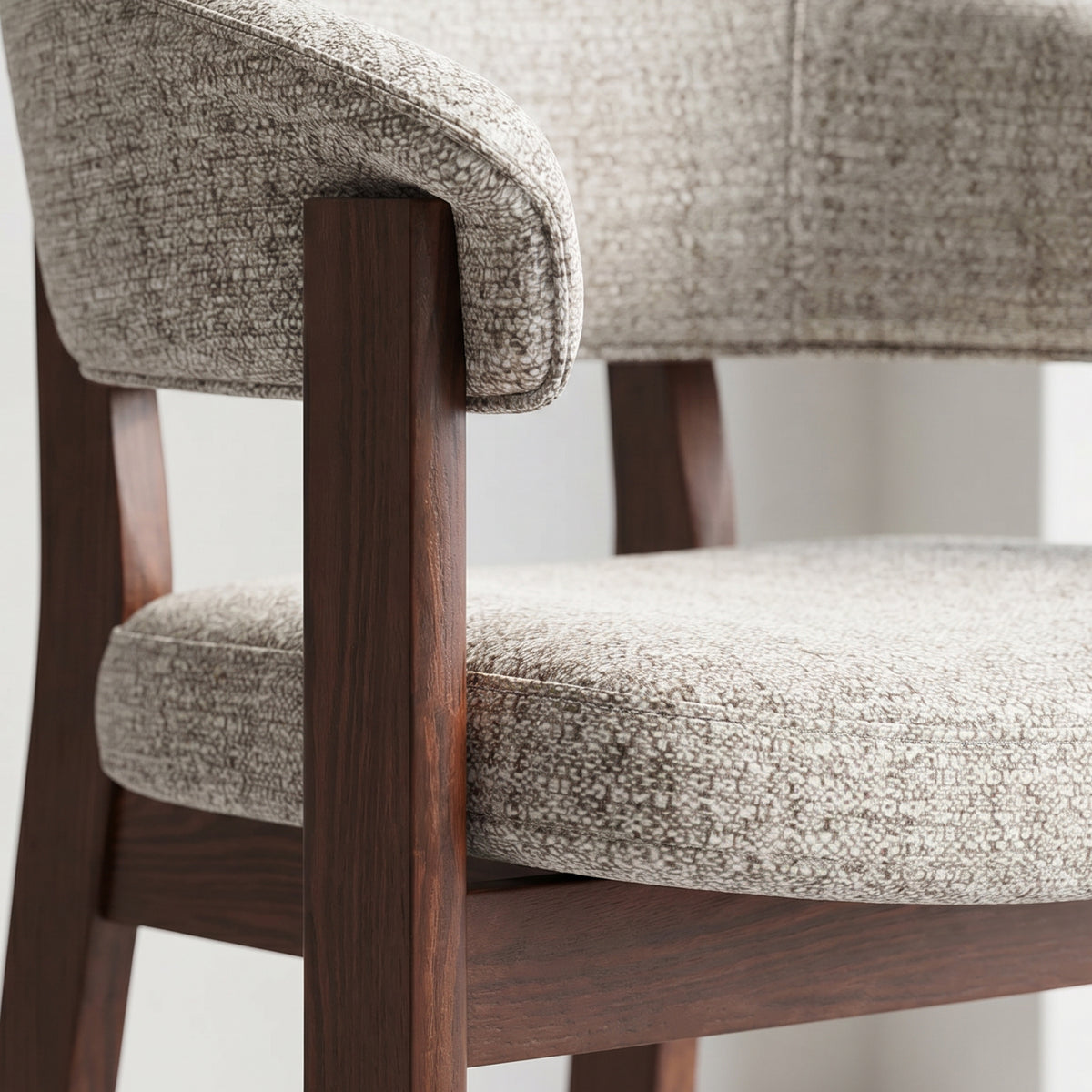 Close-up of the walnut oak frame and upholstered backrest joinery on the HALO Luxe chair