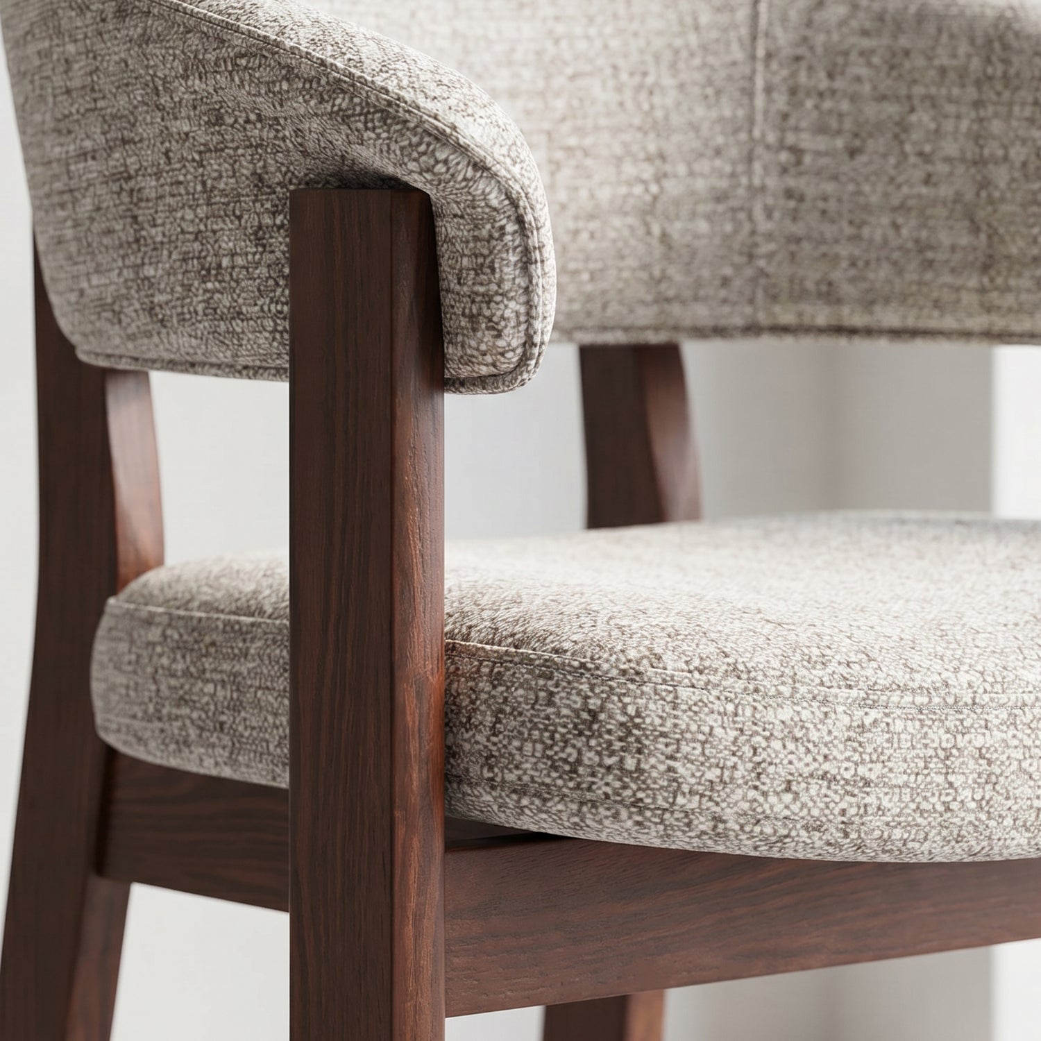 Close-up of the walnut oak frame and upholstered backrest joinery on the HALO Luxe chair