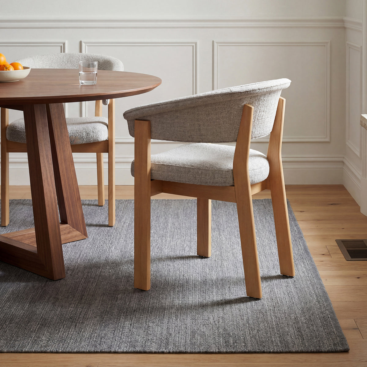 Oatmeal and natural oak HALO Luxe dining chair at a round wood dining table