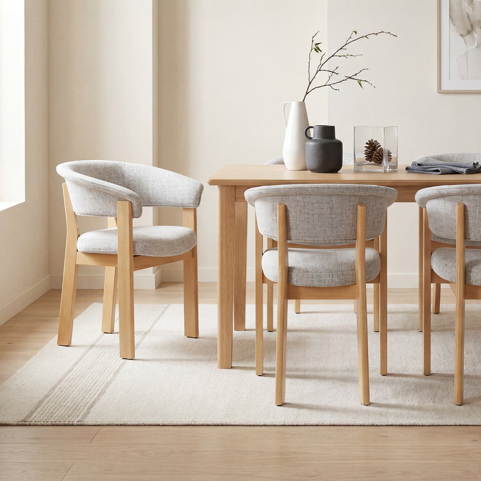 Natural oak HALO Luxe upholstered chairs styled in a bright dining room