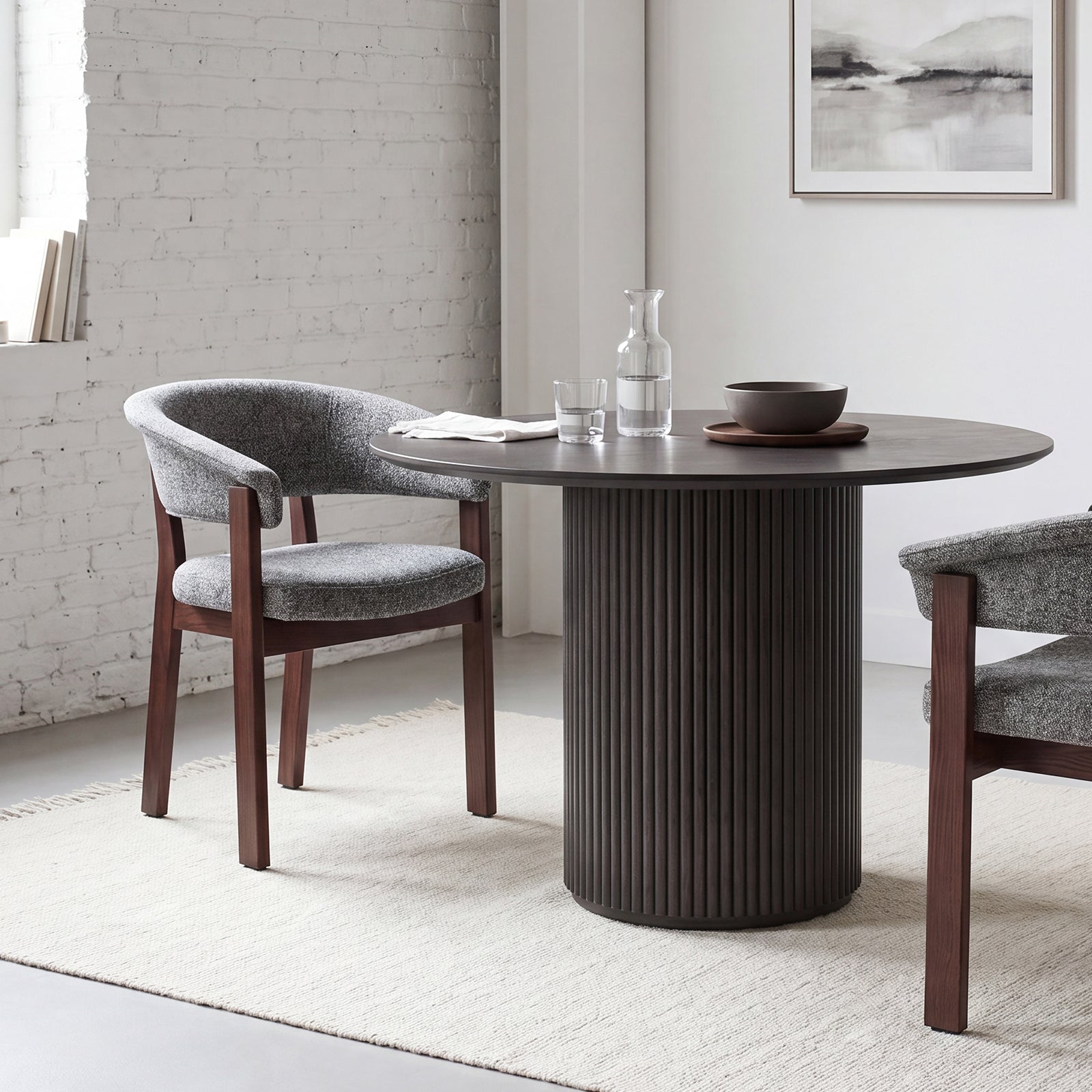 Dark gray and walnut HALO Luxe chairs styled around a black round dining table
